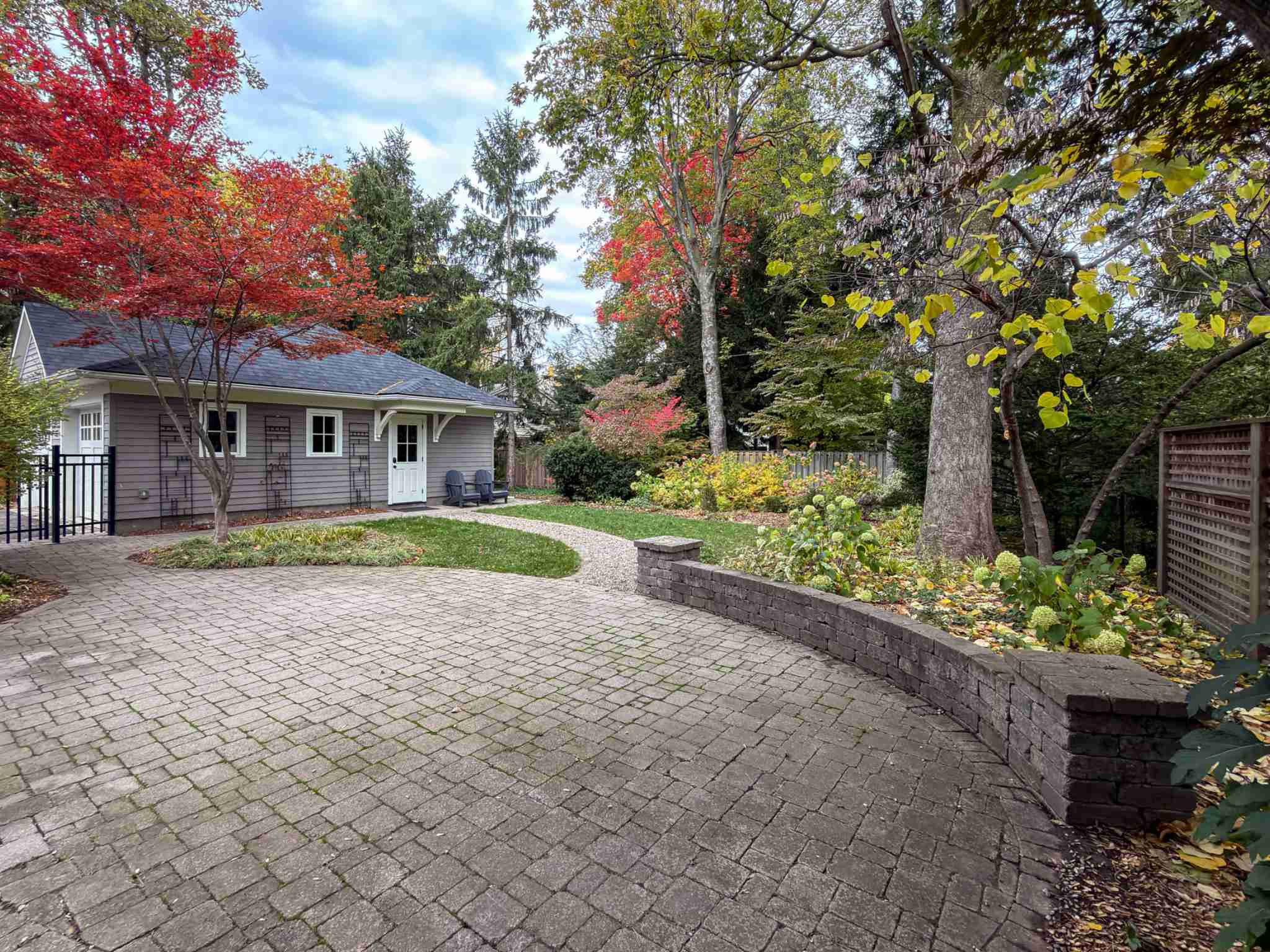 Exterior photo of backyard featuring garden beds