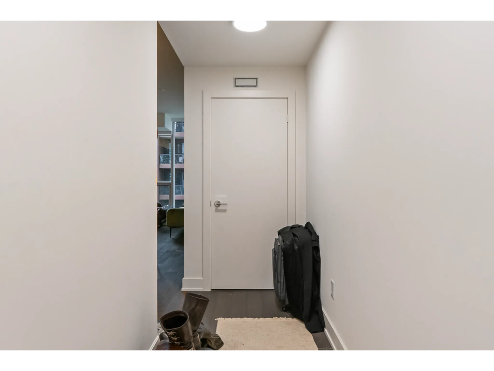 front hallway leading to laundry room closet