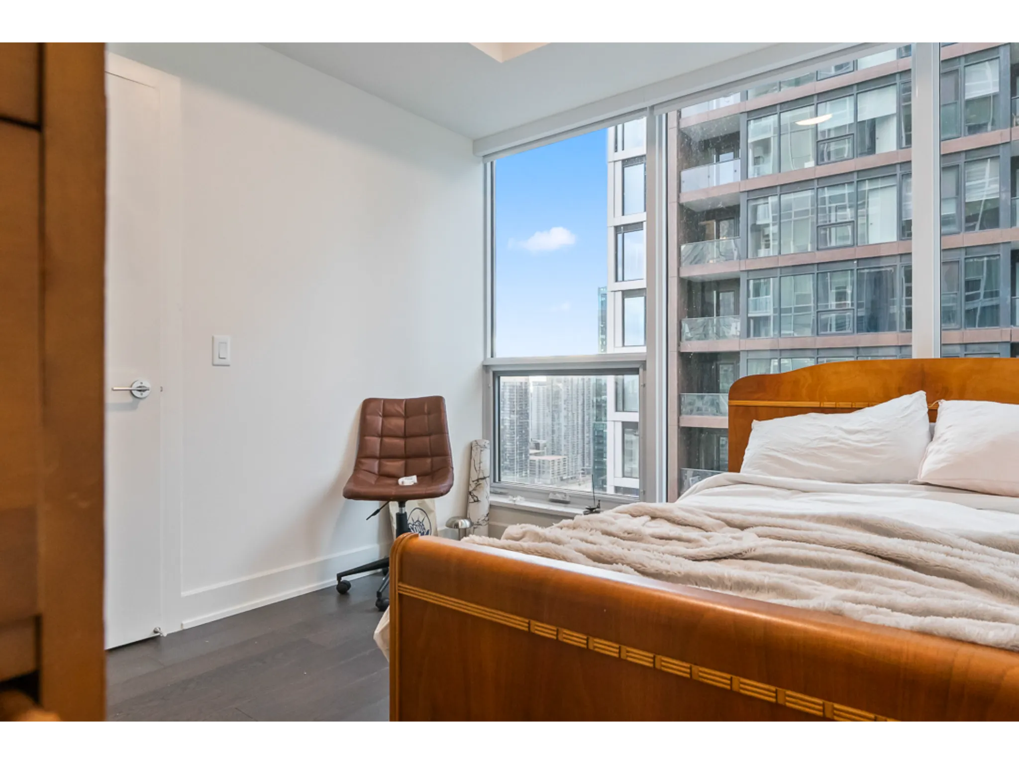 Bedroom 1 with queen size bed, large wall to wall windows