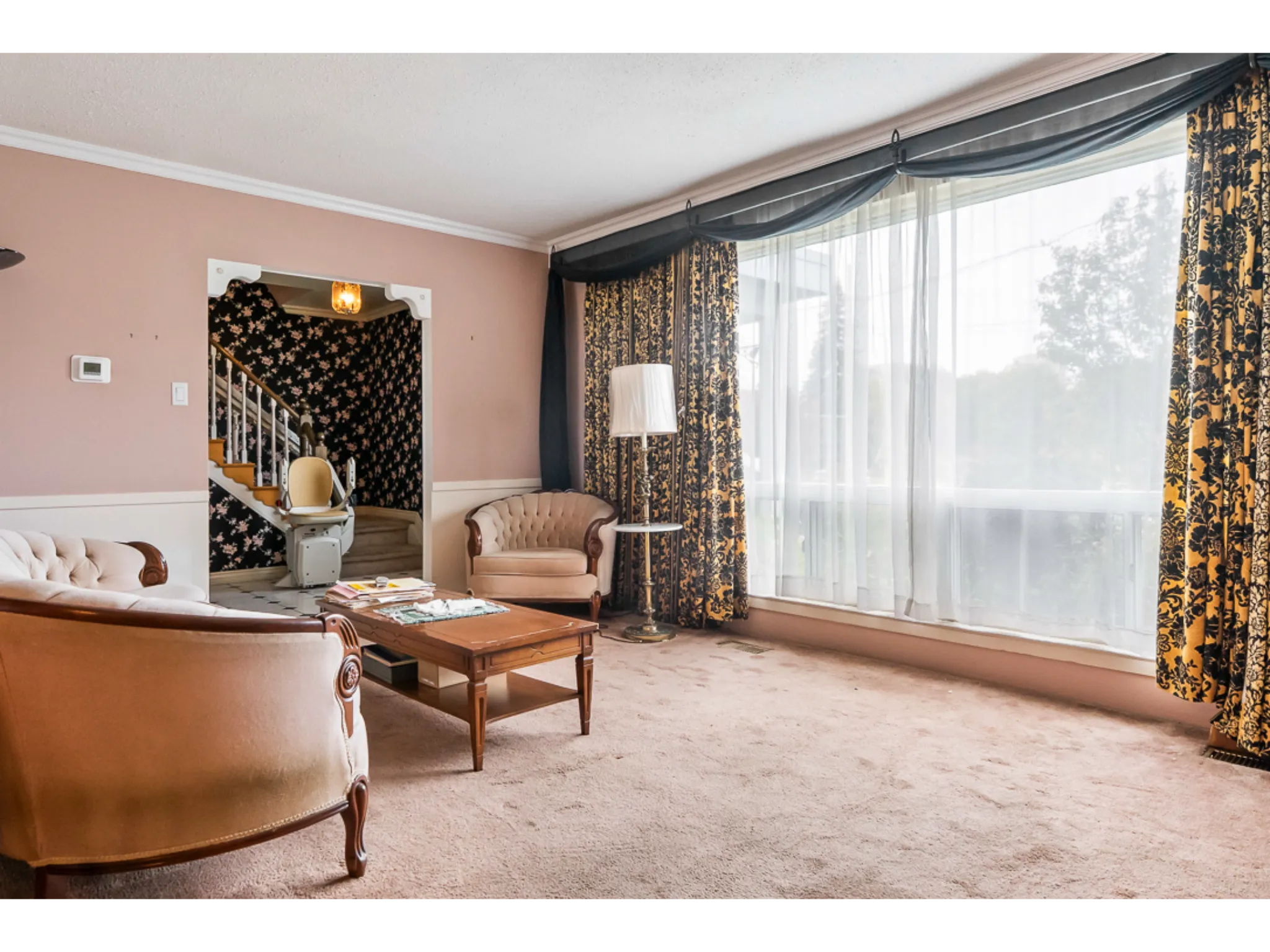 Living room with large window facing into the street