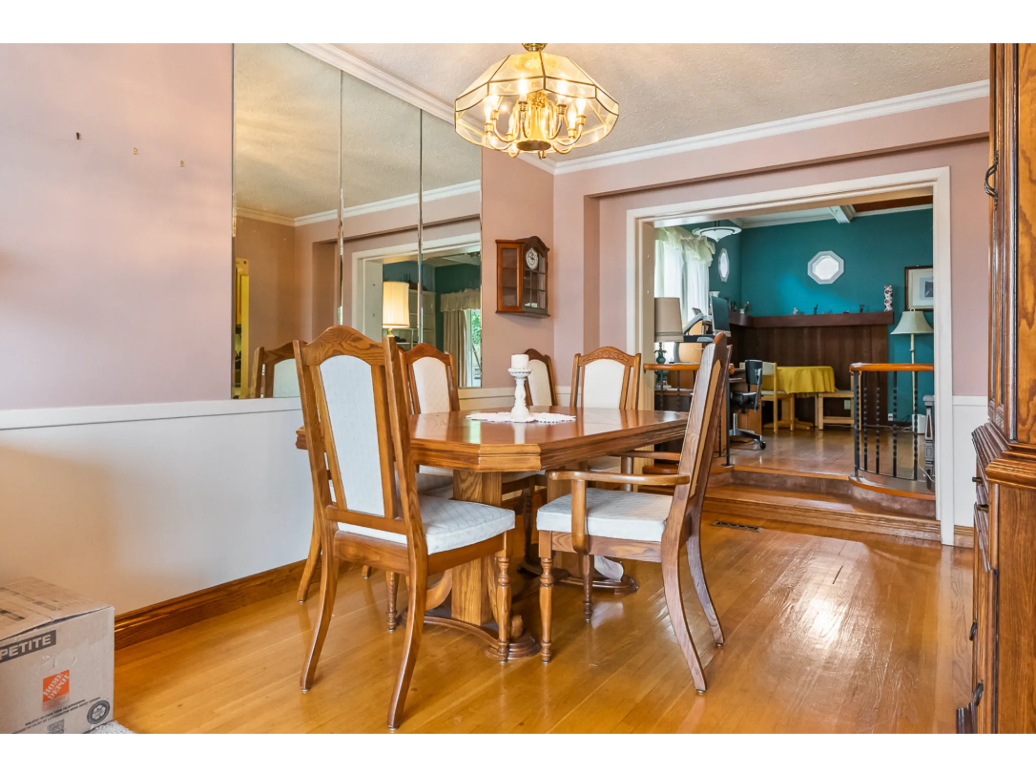 dining room with chandelier and hardwood flooring
