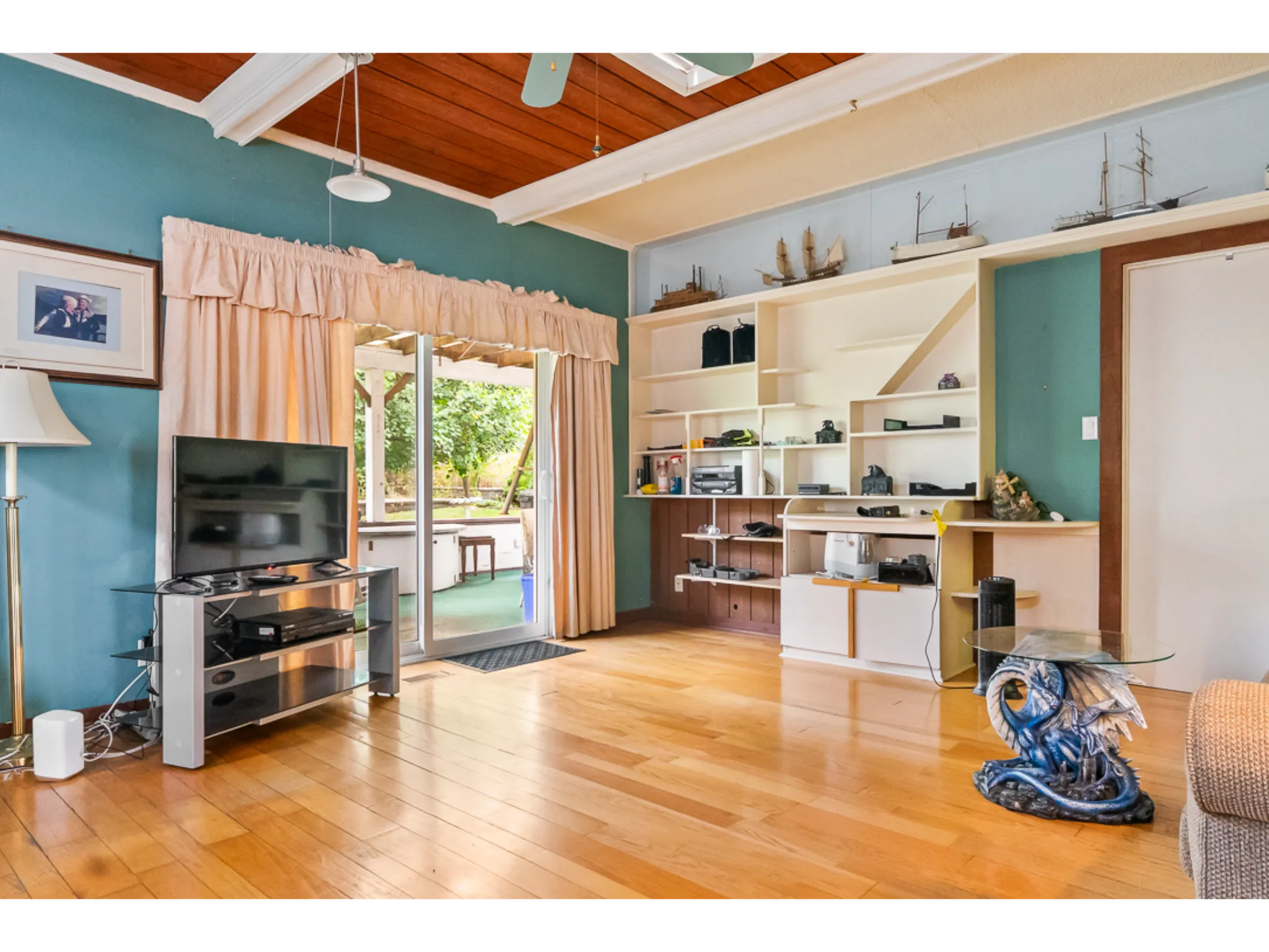 family room with cabinetry on the wall