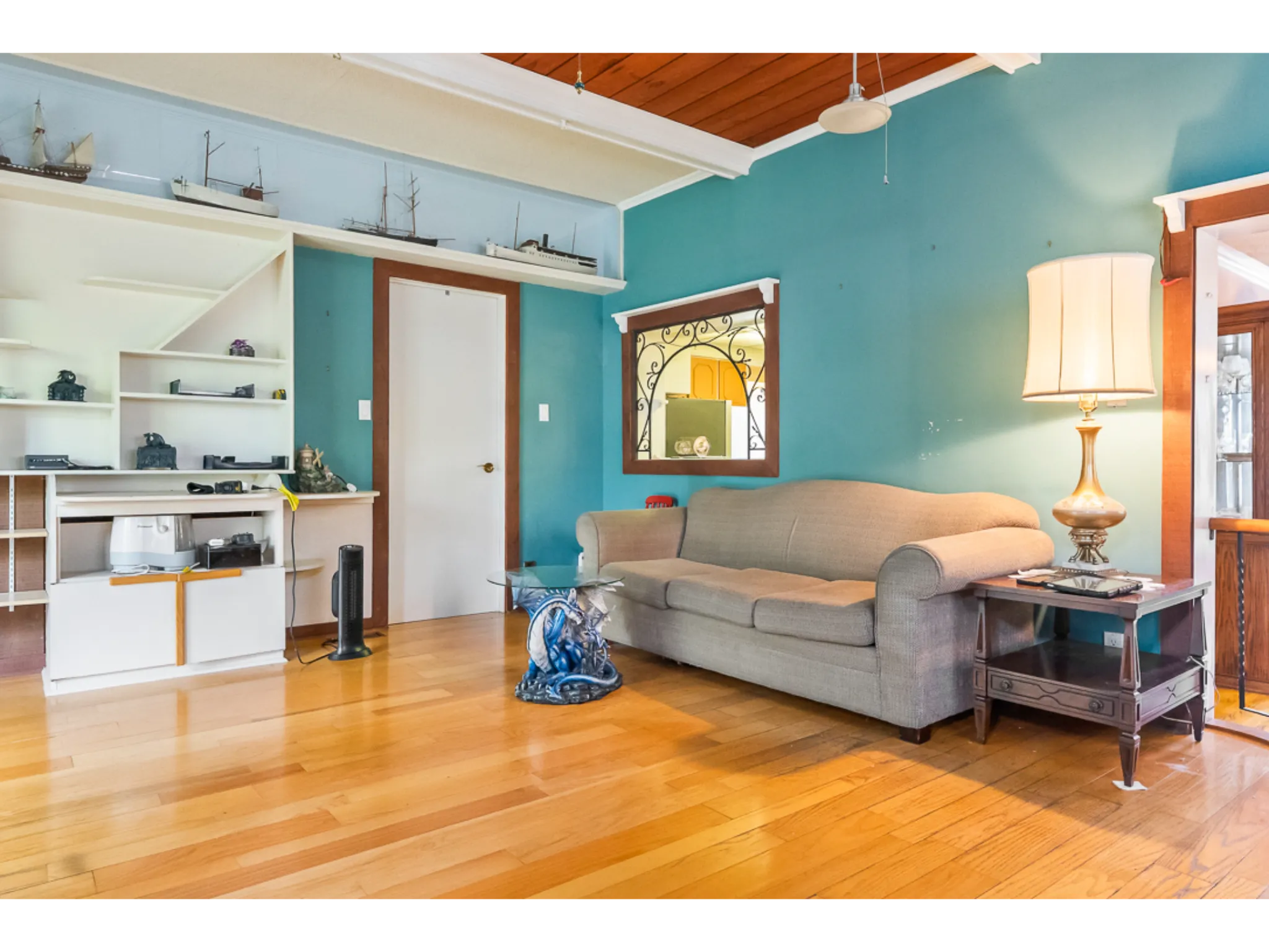 family room with couch facing out to window