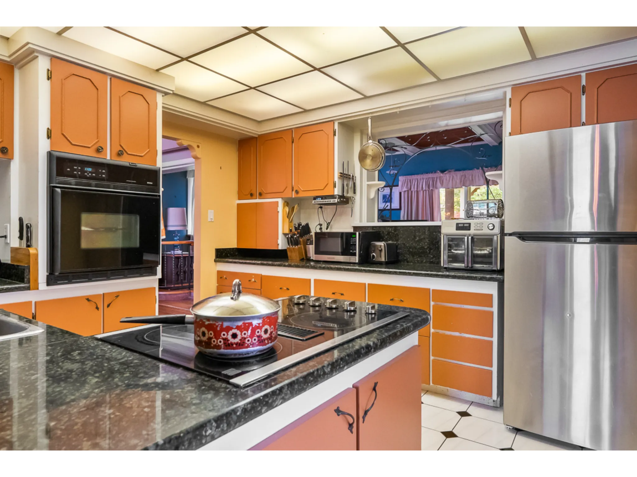 kitchen with tile floor and window allowing light