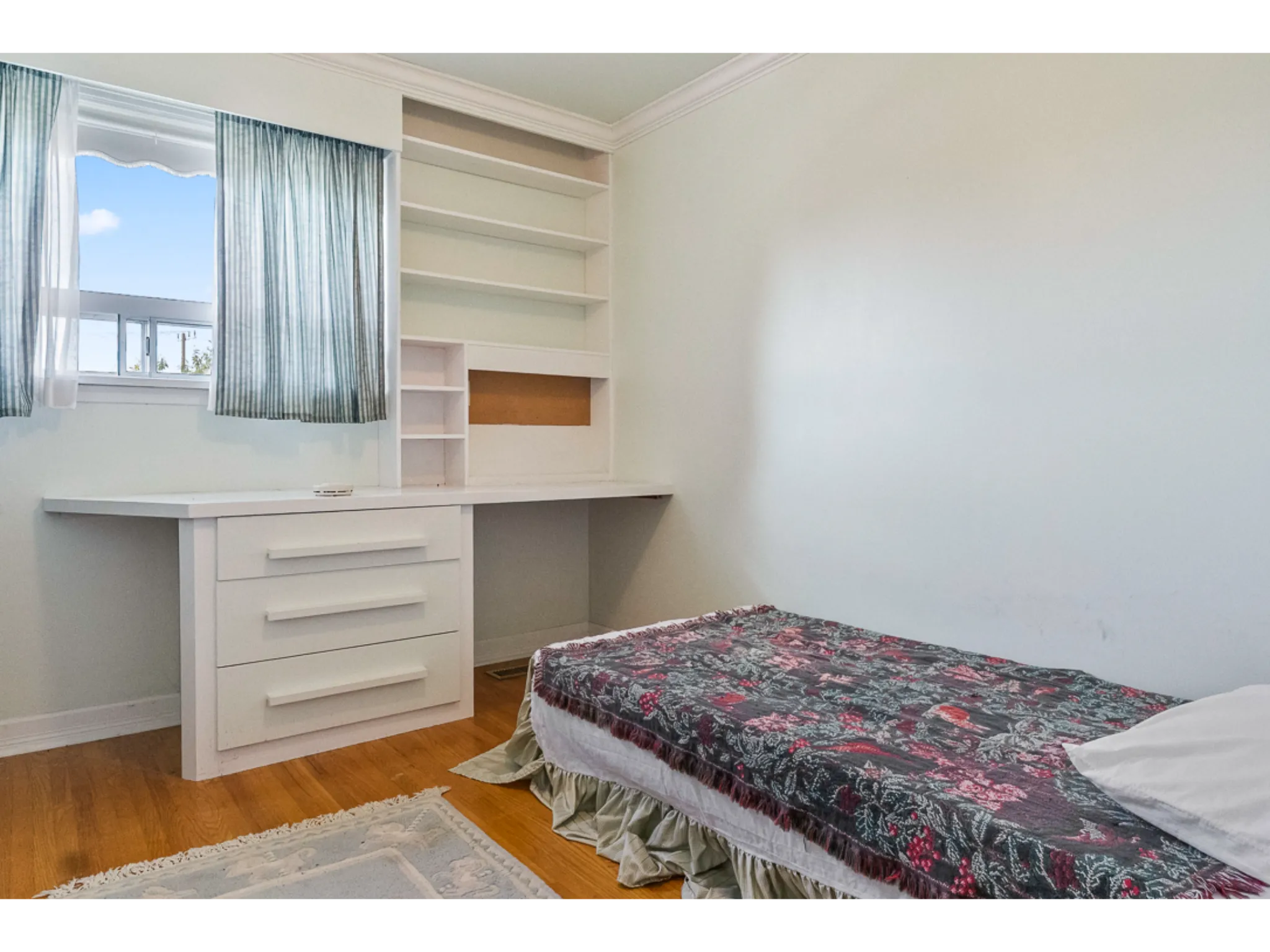 Bedroom 4 with custom built cabinets