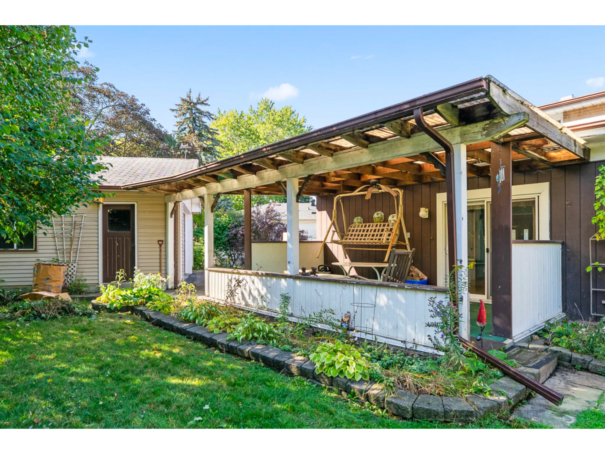 Covered back porch with seating area