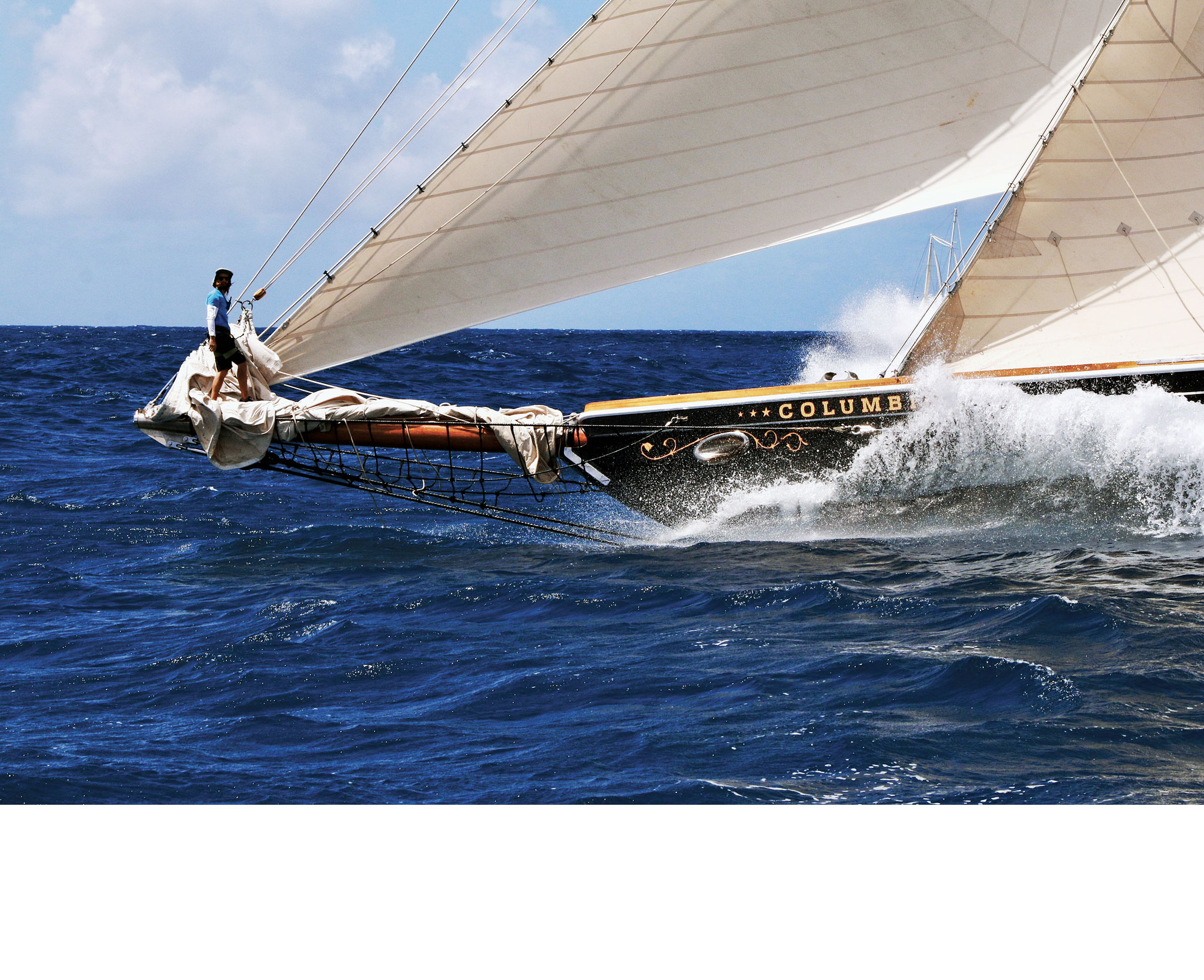 The bowman aboard Columbia has the catbird seat at the Antigua Classic Yacht Regatta. Photo by David H. Lyman