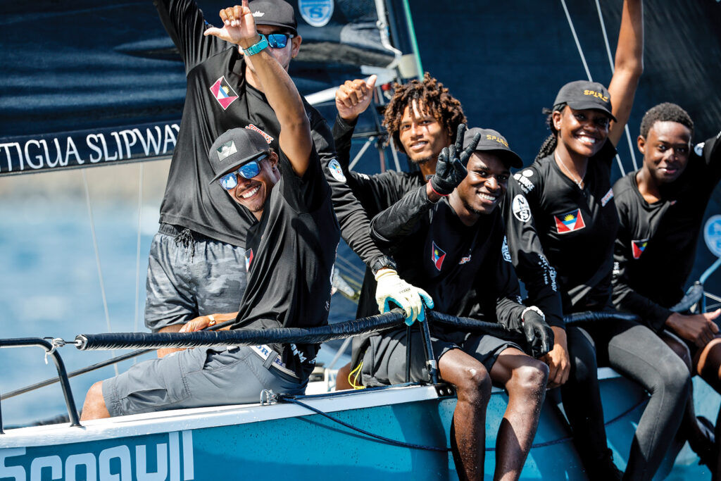  A crew at Sailing Week showboats for the photographer. 