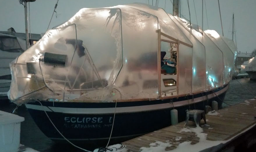 The boat in its winter cocoon on a dark night