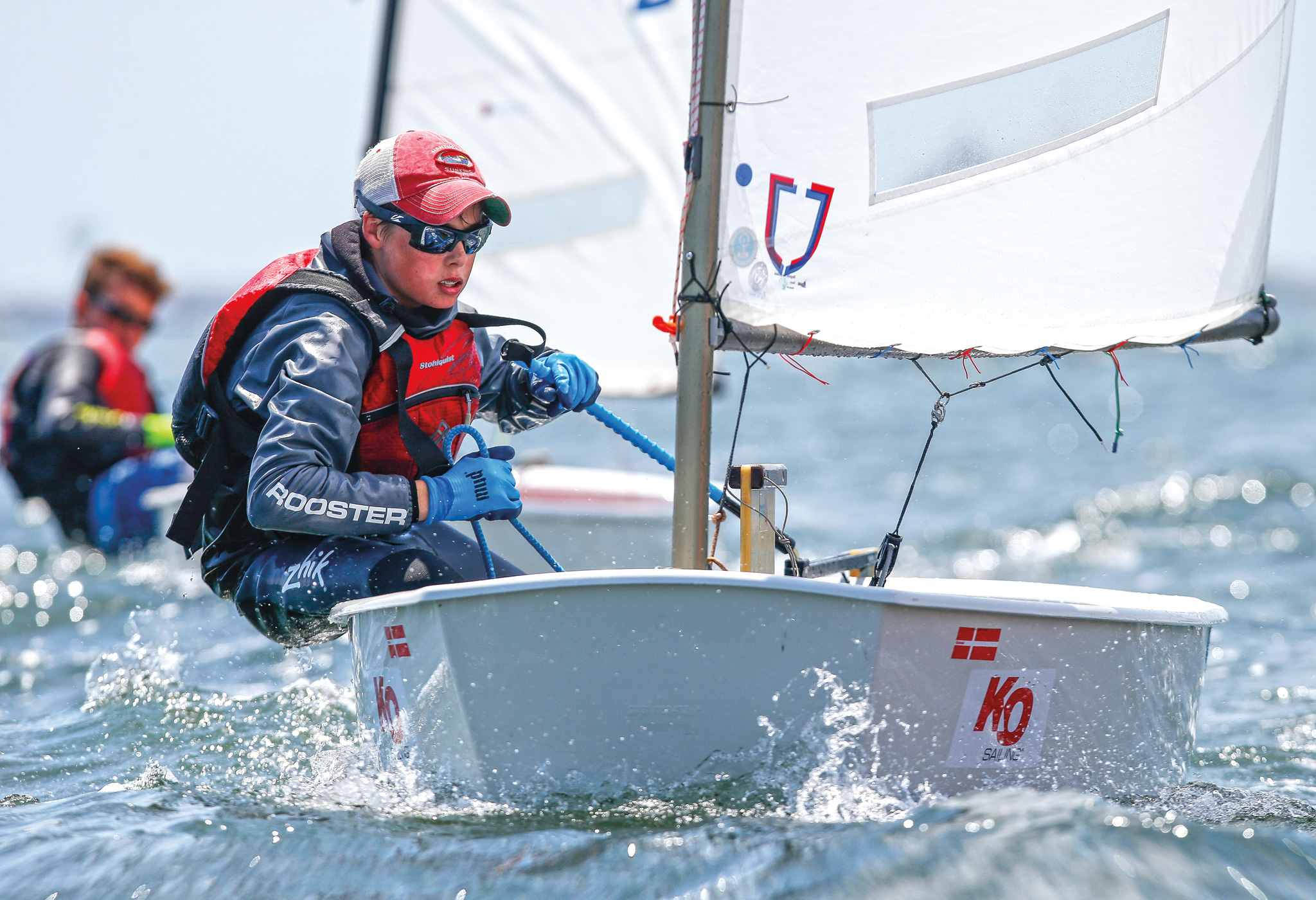 Generations have learned to sail aboard the ubiquitous Optimist. Photo courtesy Matias Capizzano/Opti class