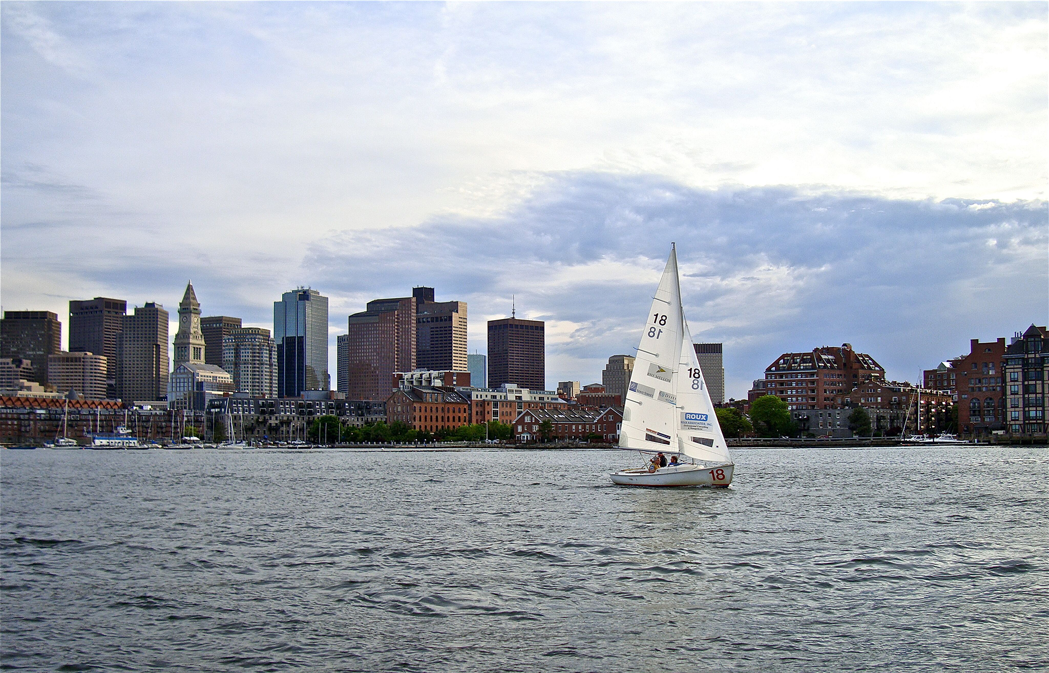 00-Alexe-1---GUaGKDY4-single-boat-sailing-away-from-skyline,-Hill-Holiday