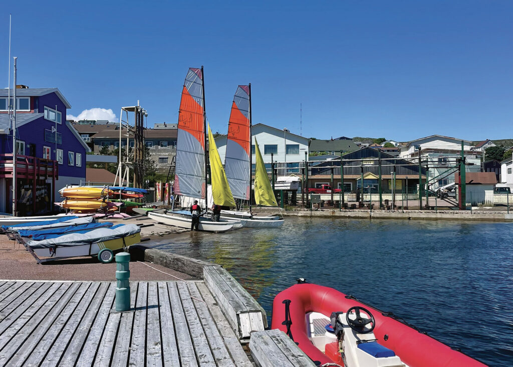 a group of sailboats on a body of water