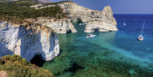 Sailboats anchor off Kleftiko on the island of Milos in the Greek Cyclades.