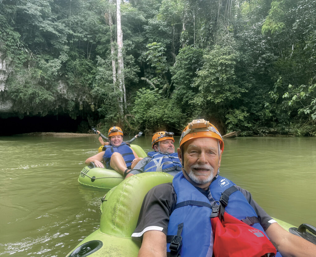 Tied together on tubes for the cave tubing tour, the gang enjoys the lazy river rafting too.