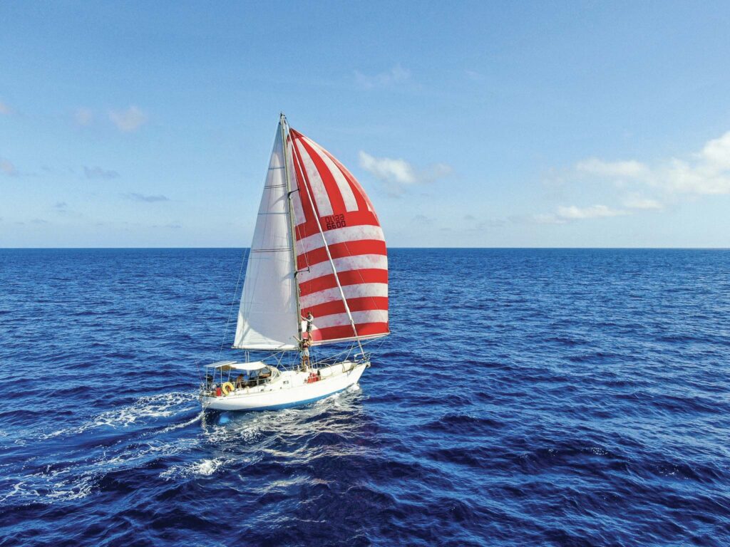 Over time, more than 50 crew have sailed on the boat with Max. Elixir and crew revel in the Pacific crossing. Photo: Nicholas Pearson