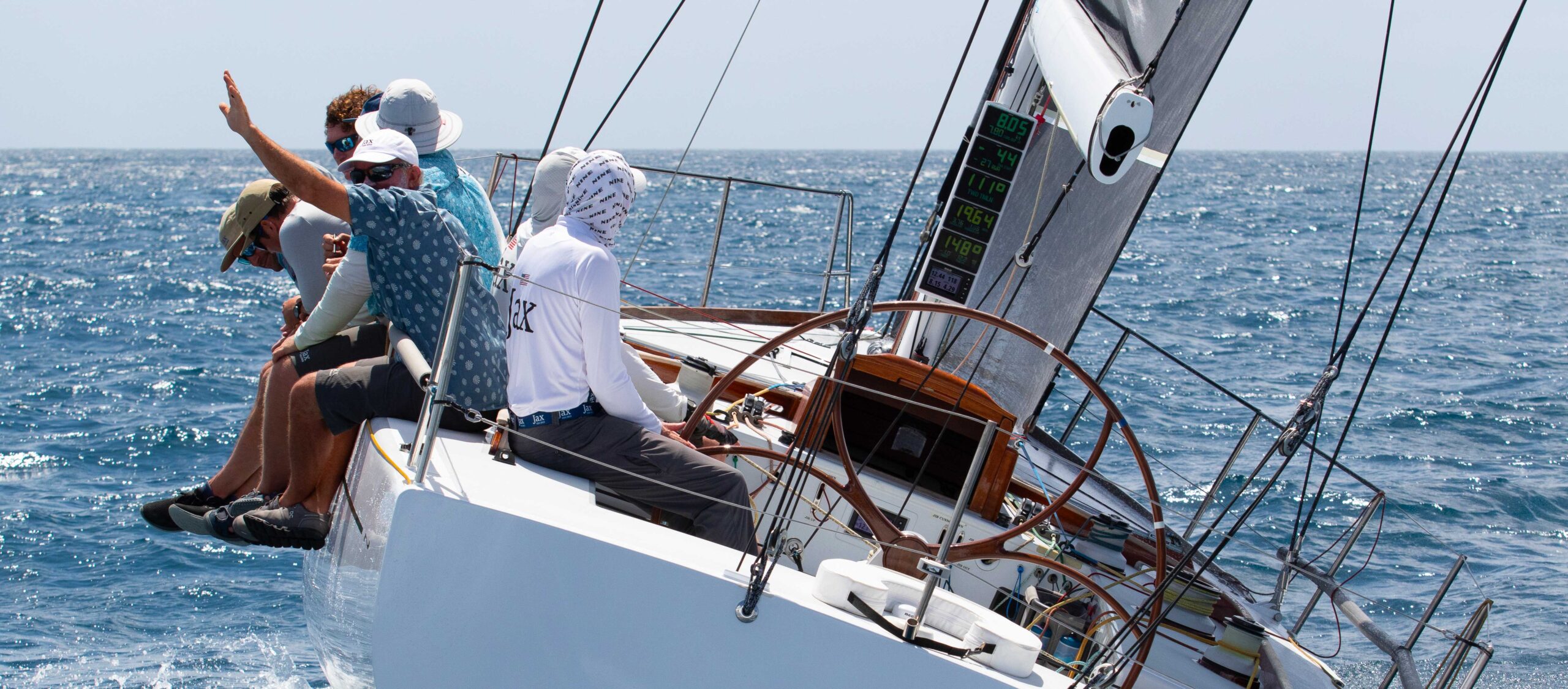 00-LEAD-IMAGE-St-Thomas-International-Regatta-JAXforSAIL4.3.2025b-hero a person on a boat