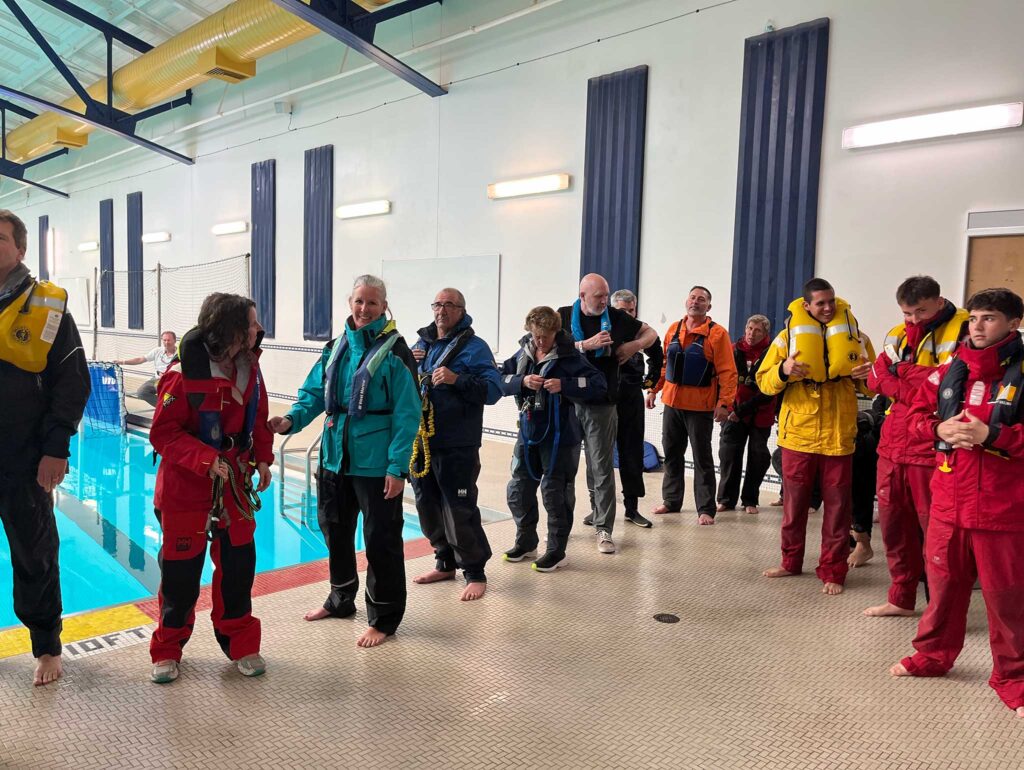 a group of people standing in a pool