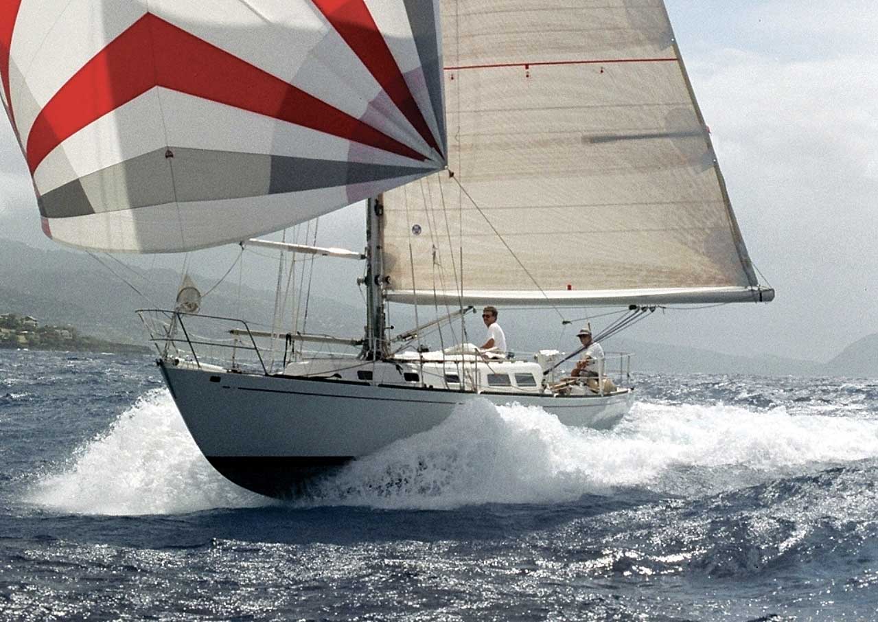 00-LEAD-By-Geri-Conser–Stan-and-Sally-C40-winning-Transpac-class Illusion surfs downwind on the way to winning her class in the Transpac. Photo by by Geri Conser