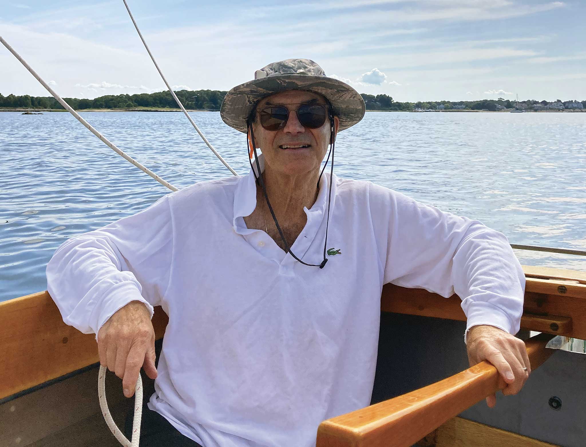 The author at the tiller of his beloved catboat, Finn. Photo courtesy of Craig Moodie