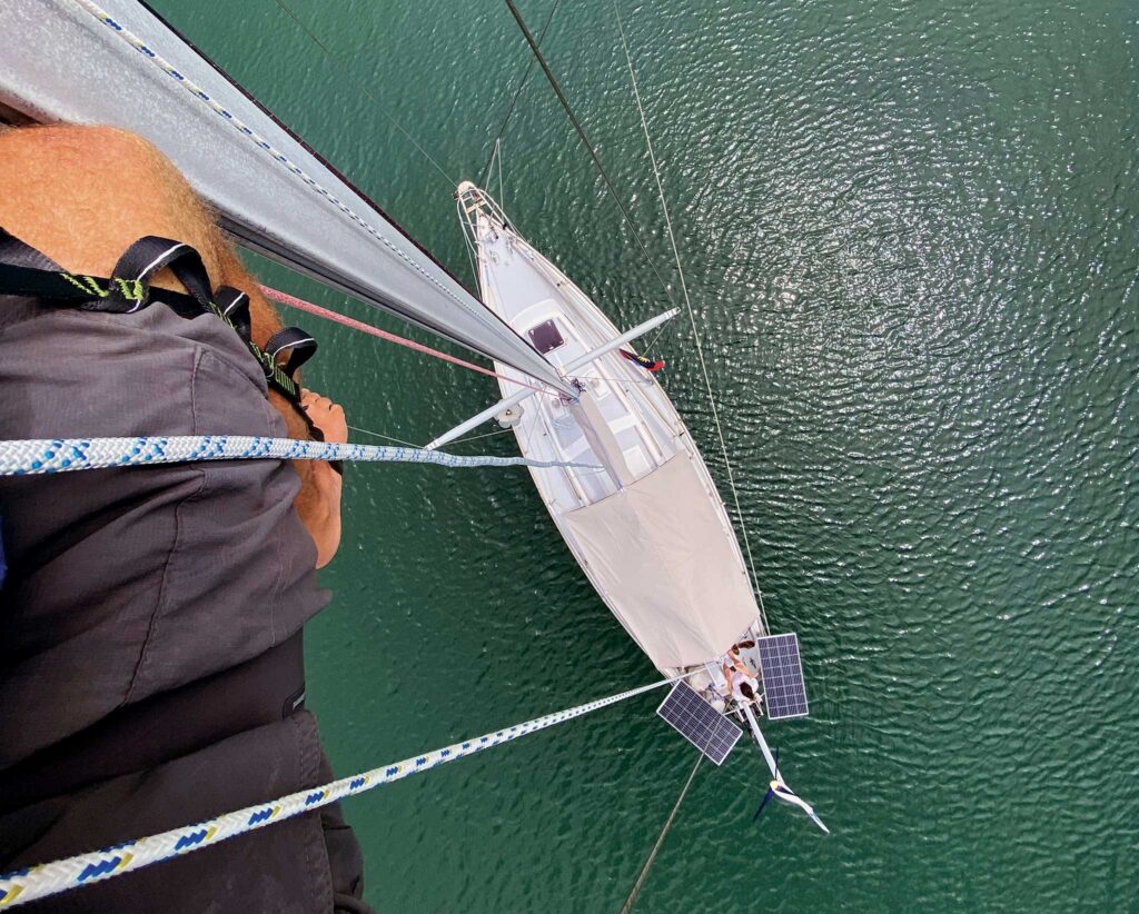 A line rigged to the anchor rode and brought aft creates an adjustable bridle that can prevent the boat from rocking in wraparound swell.
