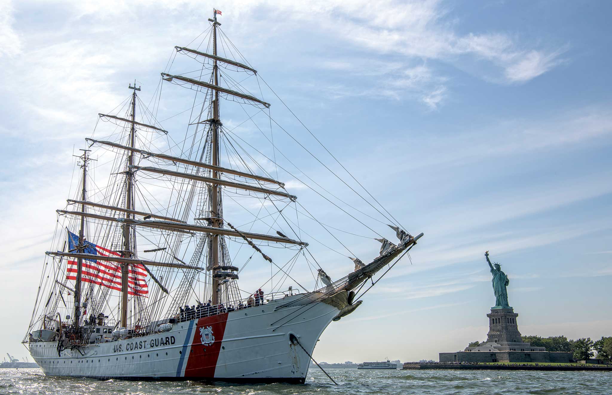Millions of spectators lined the waterfront and took to the harbor for a previous tall ship parade. Photo courtesy of Sail 4th 250