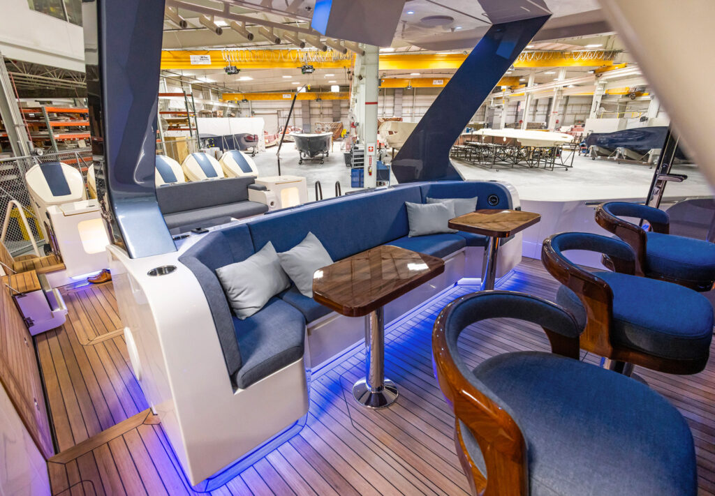 a boat with a couch and tables