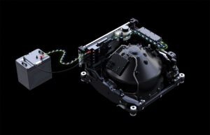 a black machine with a black box and colorful wires