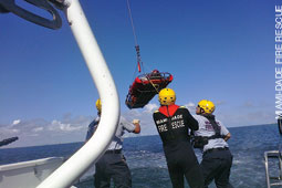 One of the victims is hoisted on board for medical treatment. One of the victims is hoisted on board for medical treatment.