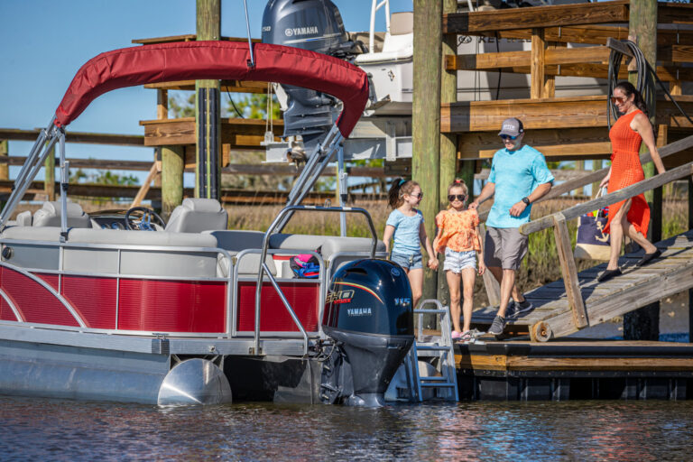 Family next to a pontoon boat