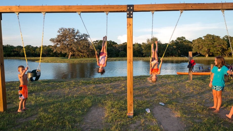 Children playing on swings