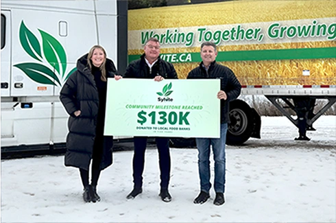 Team holding a check for $130K