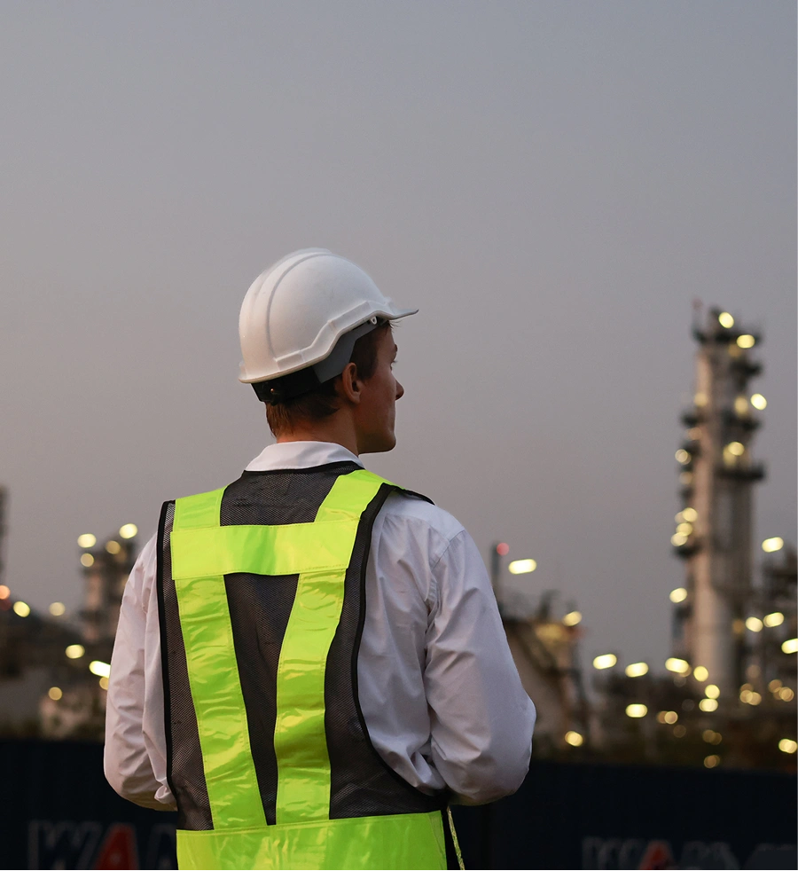 Man with a yellow safety vest and hard hat