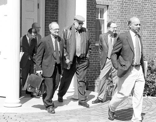 Members of Harvard's Board of Overseers leave Loeb House yesterday morning to begin a bus tour of Harvard's property in Allston. During their meeting yesterday, overseers also approved the appointment of Robert E. Rubin ’60 to the Harvard Corporation.