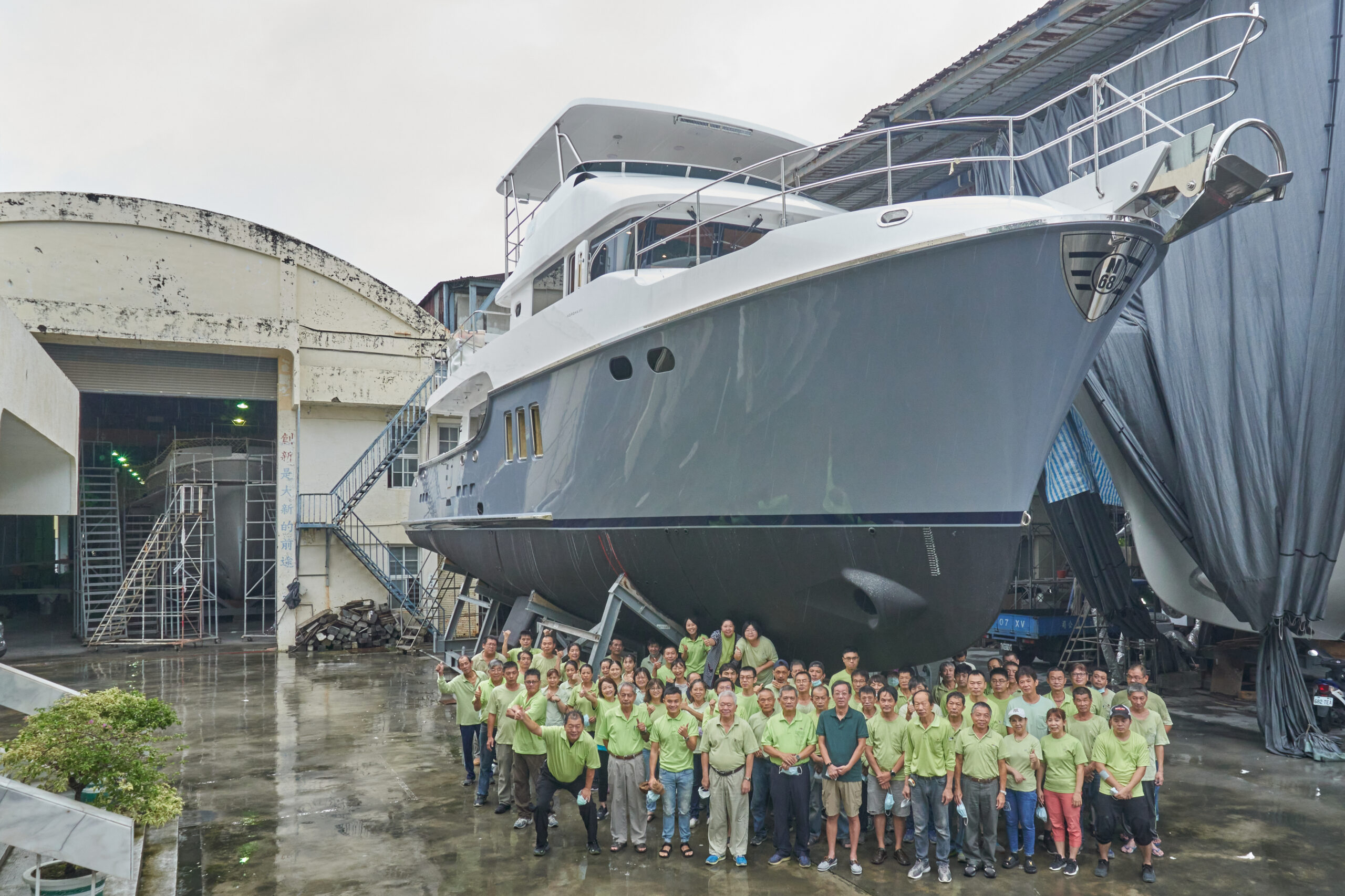 Ta Shing staff in front of 6840 completed
