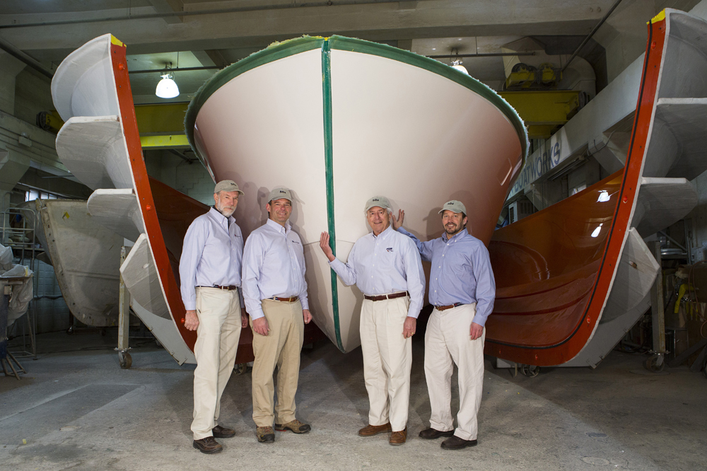 Shown with the first MJM 50z as it comes out of the mold are MJM team members (from left) Mark Lindsay, Scott Smith, Johnstone and designer Doug Zurn. Shown with the first MJM 50z as it comes out of the mold are MJM team members (from left) Mark Lindsay, Scott Smith, Johnstone and designer Doug Zurn.