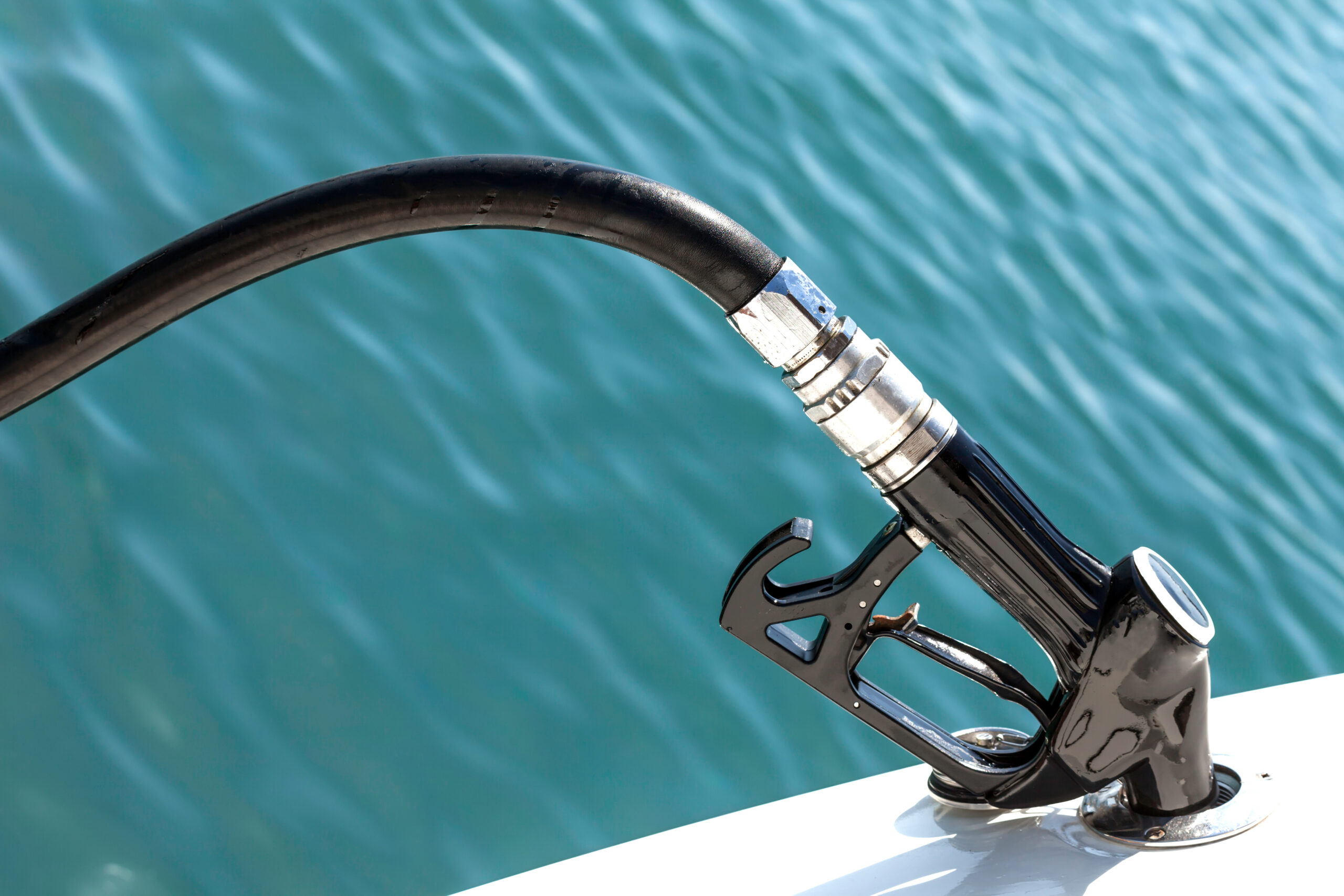 Diesel fuel pump refueling a motor boat Fuel pump in a boat.