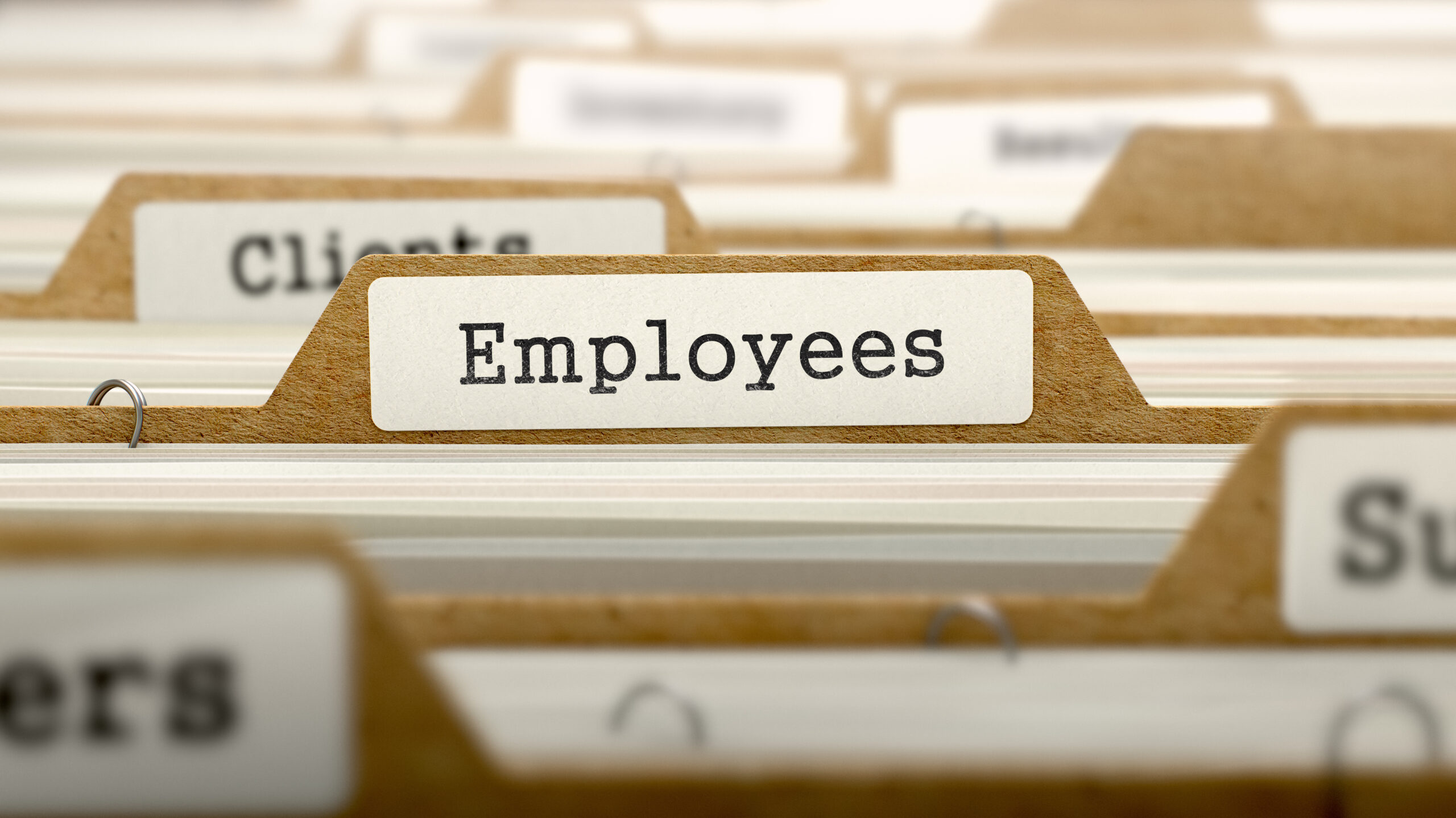 Employees Concept with Word on Folder. PHOTO COURTESY ADOBE STOCK