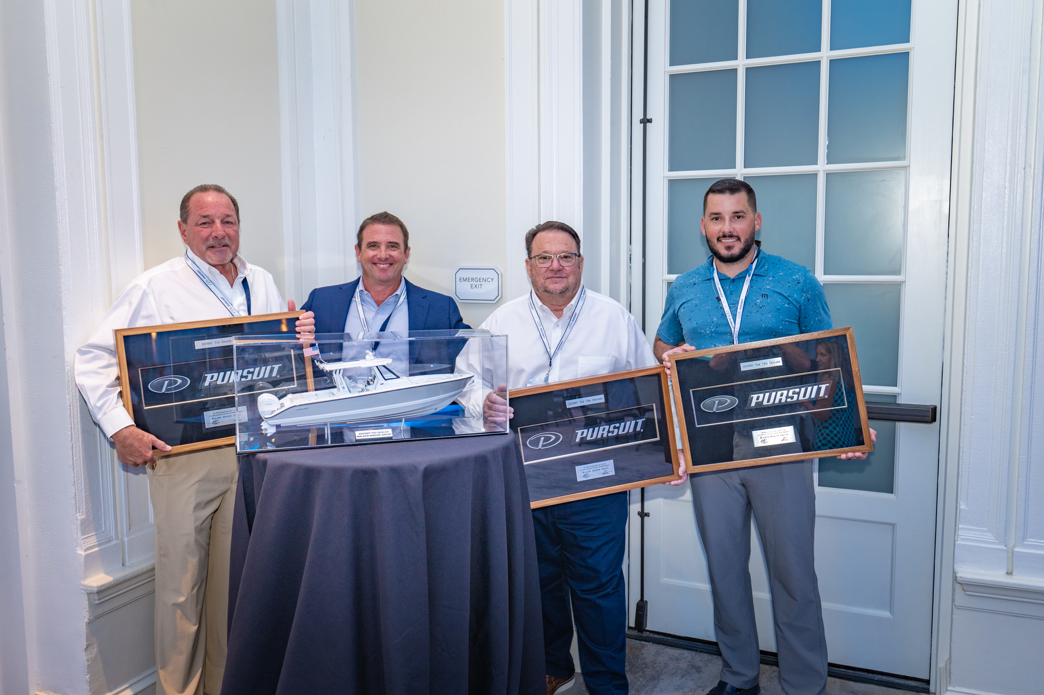 1_PURSUIT From left, Bob Degryse, Shawn Henderson, Eddie Sharp and Cody Thoman of Walker Marine Group, which took top dealer honors at the Pursuit conference. PHOTO COURTESY PURSUIT BOATS