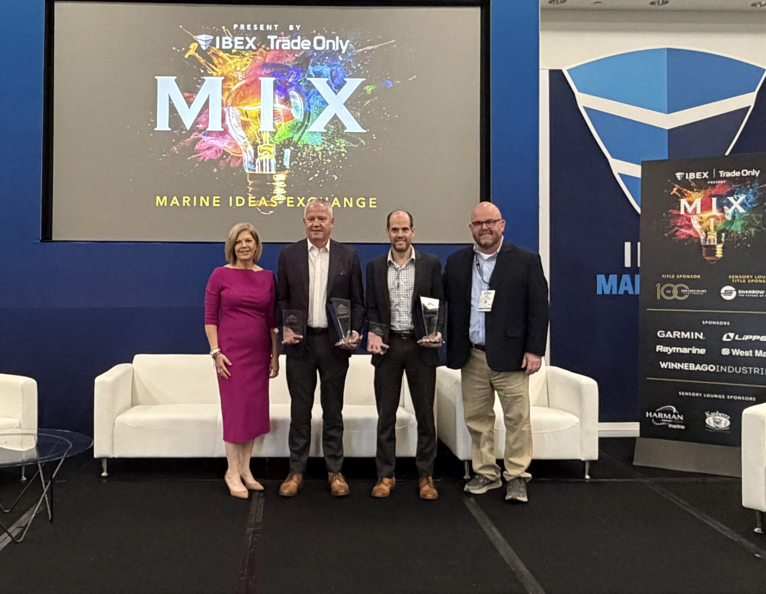 (From left) Michele Goldsmith (Soundings Trade Only), Eric Fetchko (Dometic), Jarrod Seymour (Garmin), and Gary Reich, (Soundings Trade Only). 