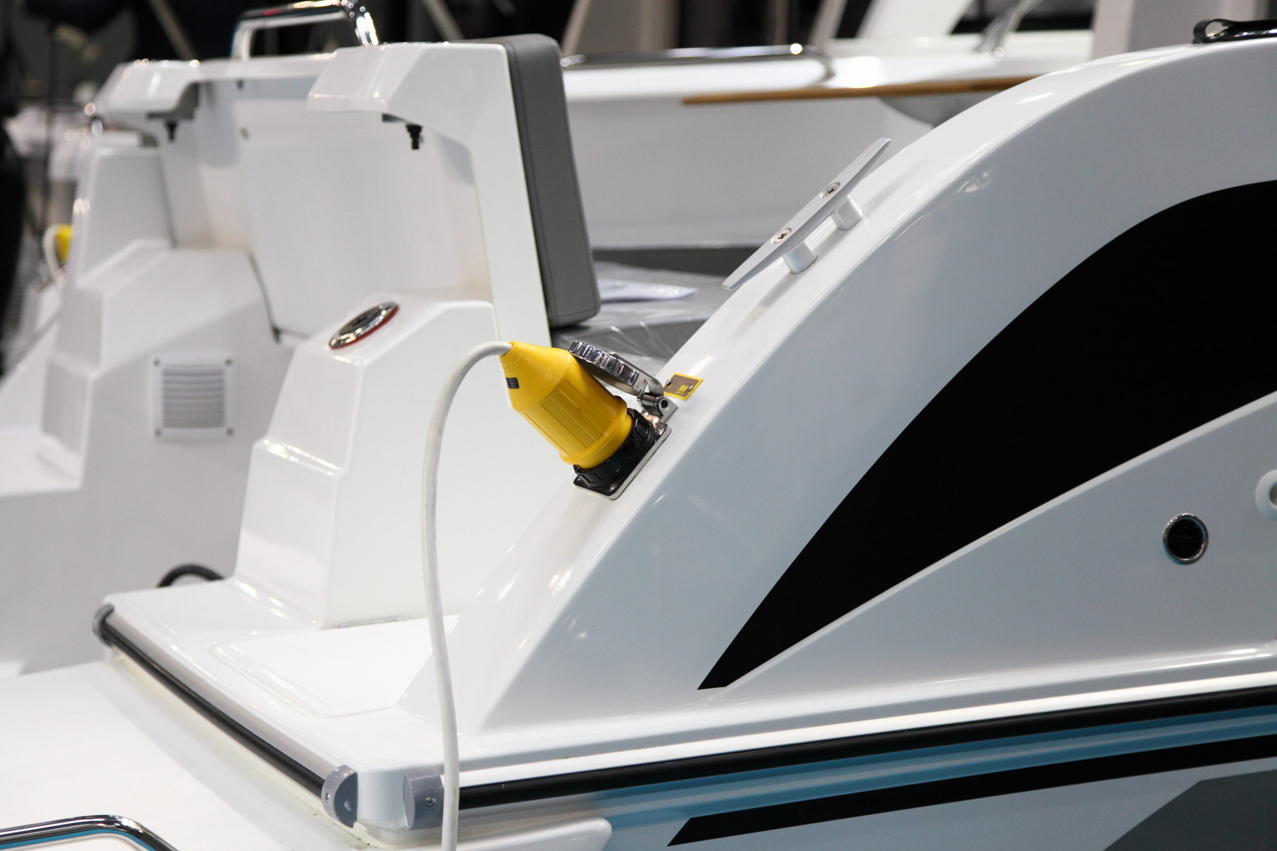 Electric plug of the shore power supply is connected to the outlet on Board the motor yacht, Parking in the Marina A smart electrical system anticipates upgrades and improvements but keeps the basic principles intact. PHOTO: ILYA - STOCK.ADOBE.COM