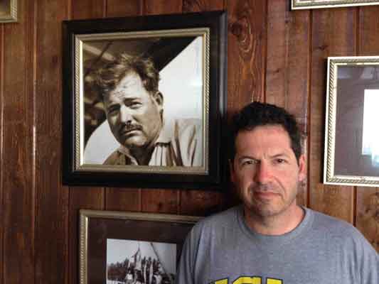 HemingwayInBimini-2 John Hemingway with a photo of his grandfather Ernest