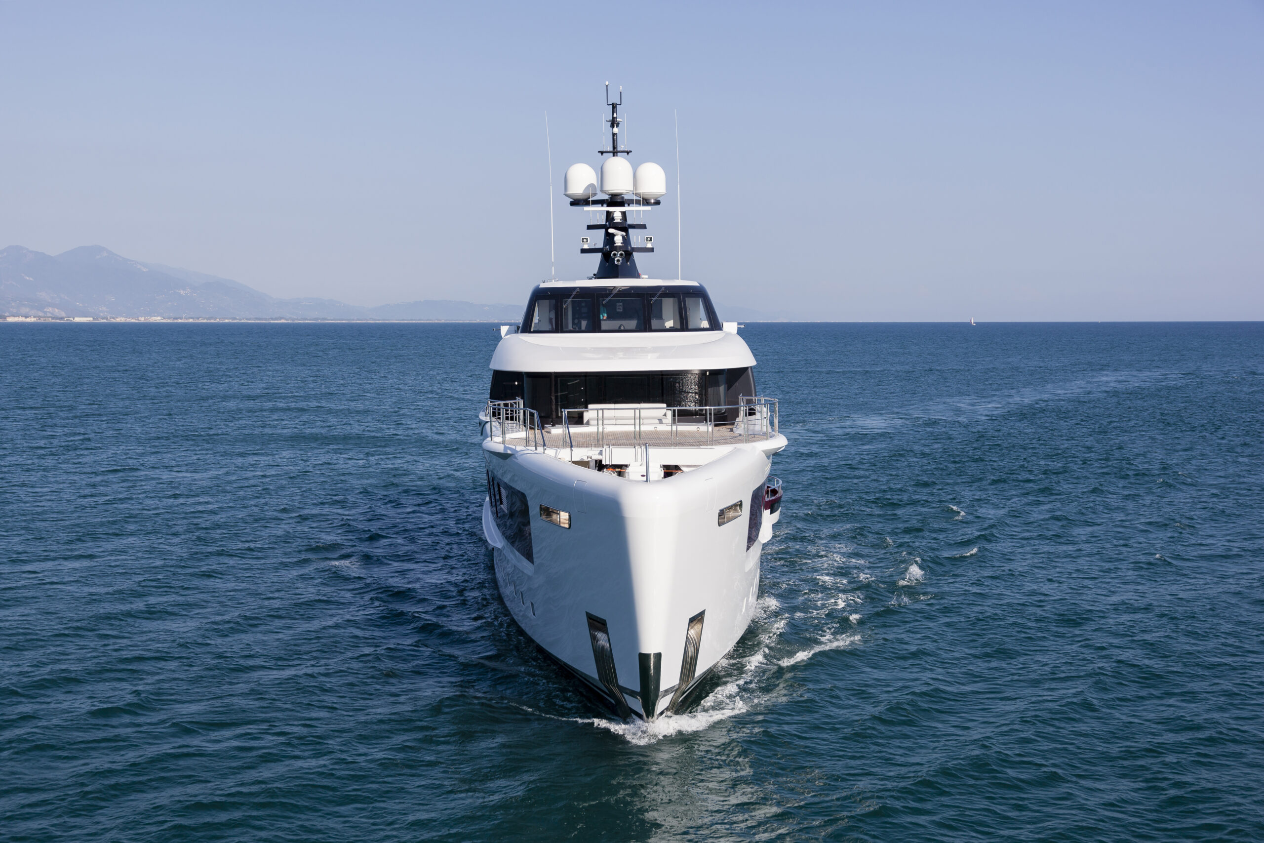 Admiral QUINTA ESSENTIA — At sea The Admiral E Motion hybrid Quinta Essentia is unlikely to be confused with any other yachts moored along the French and Italian rivieras. Not only does the 180-foot (55-meter) superyacht have eye-catching exterior styling that singles her out from the crowd, but she is truly a standout beneath her striking burgundy and white livery.