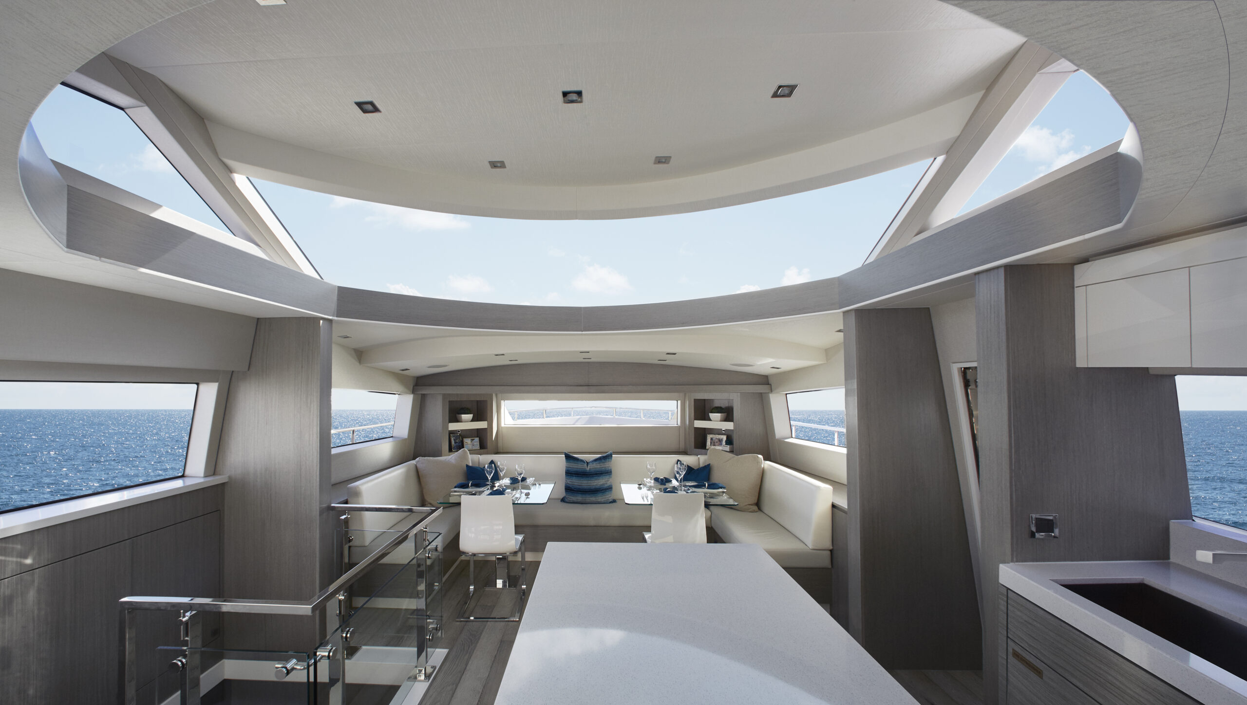 70MY_Atrium A wraparound windshield acts as a skylight that floods the country kitchen-style galley and dining area with natural light.
