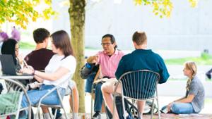 Steven Yao, the Edmund A. LeFevre Professor of English, converses with students.