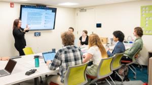 The researchers meet with Heather Hage &rsquo;02 at the Grifiss Institute.