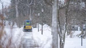 Clearing the walkways on campus after a snowfall.