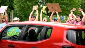 Upperclassmen welcome new student coming up College Hill Road 