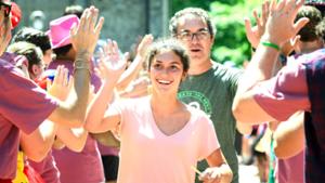 New students and their families make their way through the gauntlet of orientation leaders.