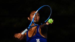 Grace Qian ‘27  practices her serve at the Tietje Family Tennis Center.