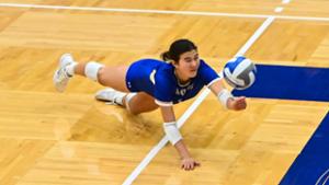 Mia Jessen ’28 (8) returns the ball in a volleyball game against Wesleyan University in the Margaret Bundy Scott Field House.